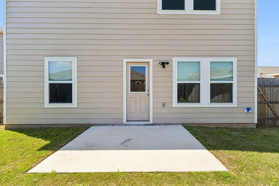 Property entrance with a patio