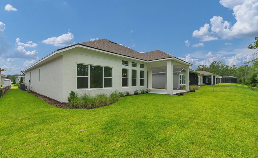 Exterior details and patio area of a home in Woodhaven, Port Orange (Image 2).