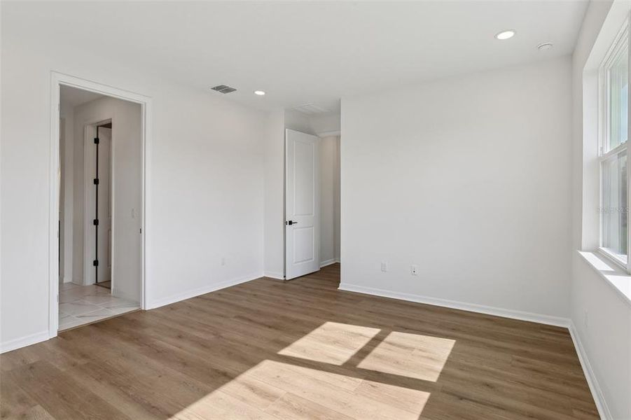 Spacious, unfurnished interior of a new home in Primrose at Longleaf, New Port Richey (Image 36).