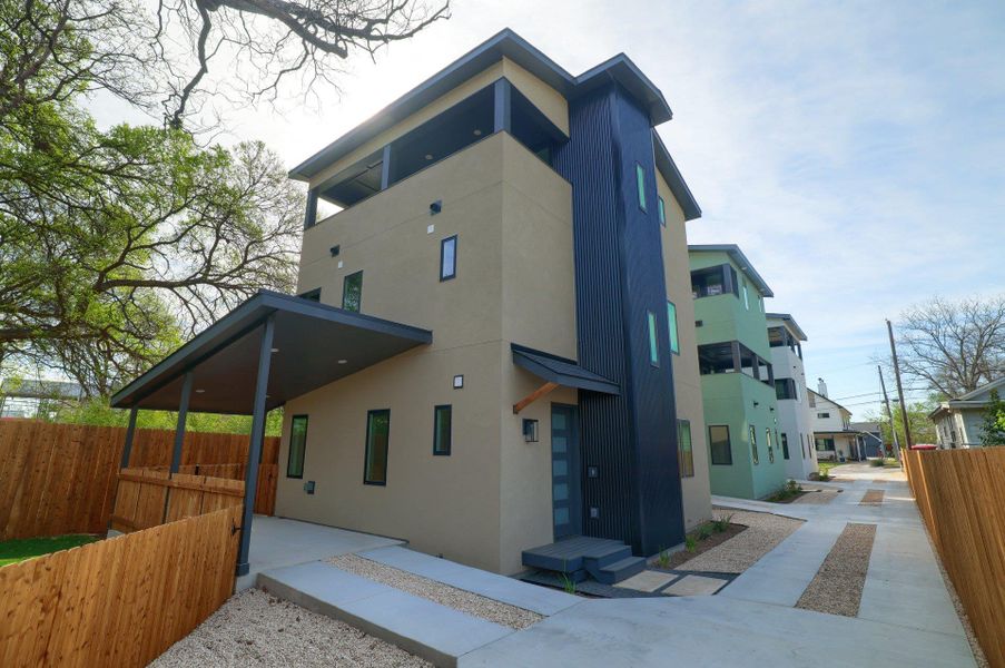 Rear view of house with stucco siding
