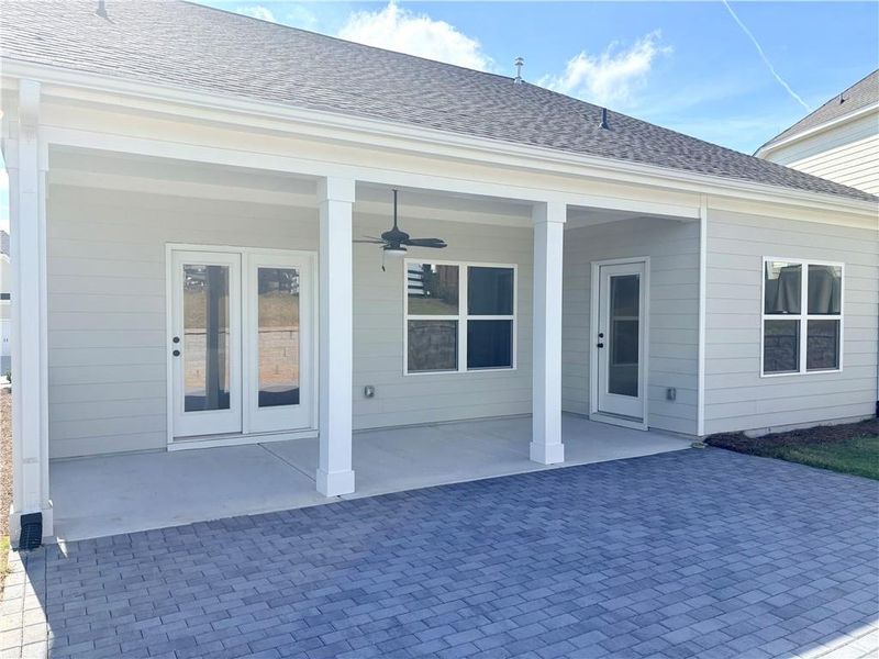 Exterior details and patio area of a home in Heritage Pointe at The Georgian, Villa Rica (Image 3).