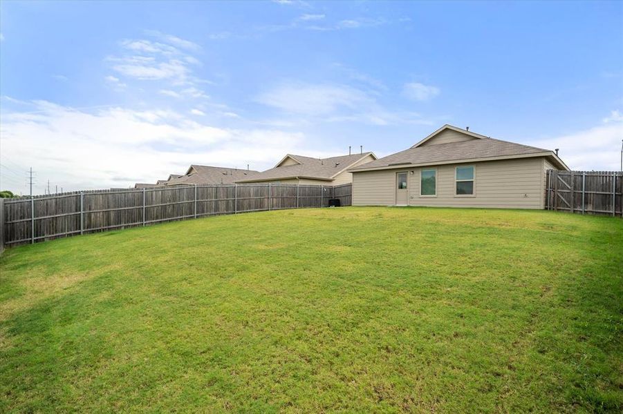 View of fenced backyard