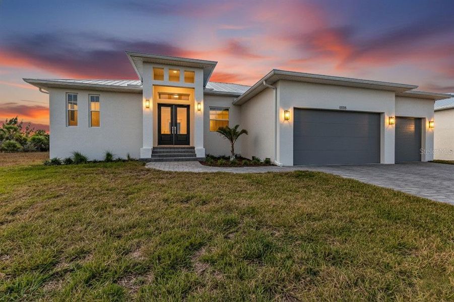 Front exterior of a new home in , Port Charlotte, FL, highlighting curb appeal (Image 1). Front exterior of a new home in , Port Charlotte, FL, highlighting curb appeal (Image 1).