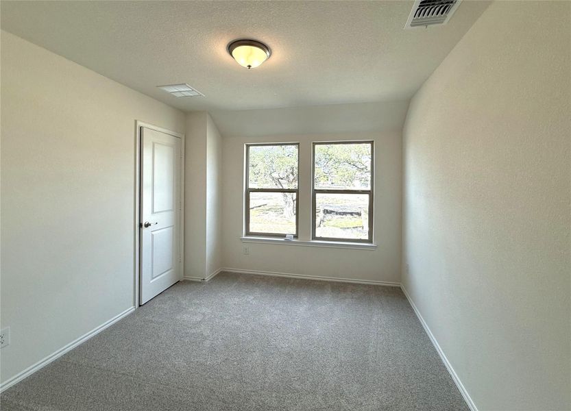 Spacious, unfurnished interior of a new home in River Bluff, Leander (Image 24).