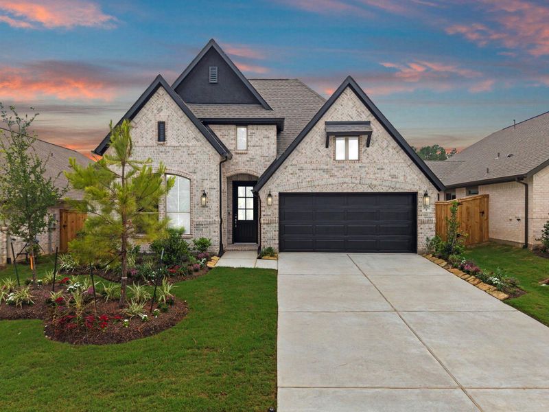 Front exterior of a new home in Wildtree, Magnolia, TX, highlighting curb appeal (Image 21).