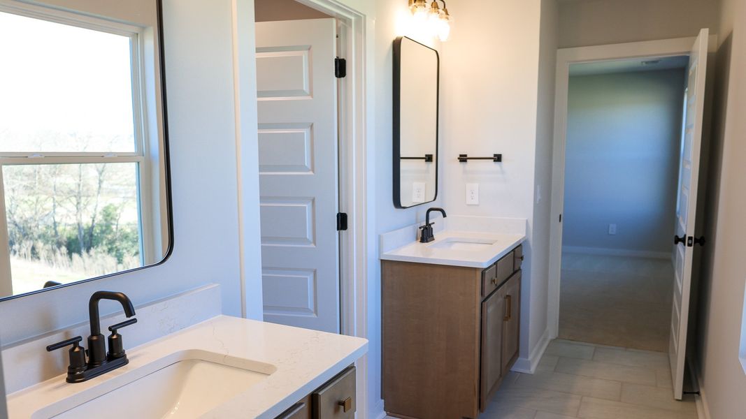 Representative furnished interior of a home built from the STONEBROOK II by D.R. Horton in Harvest Point, Spring Hill (Image 33).