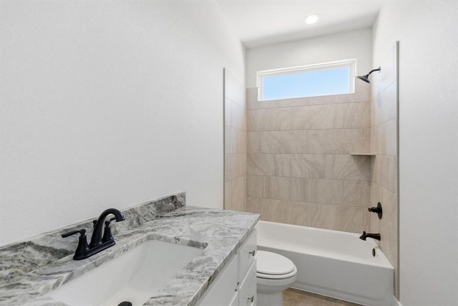 Full bathroom with tub / shower combination and vanity