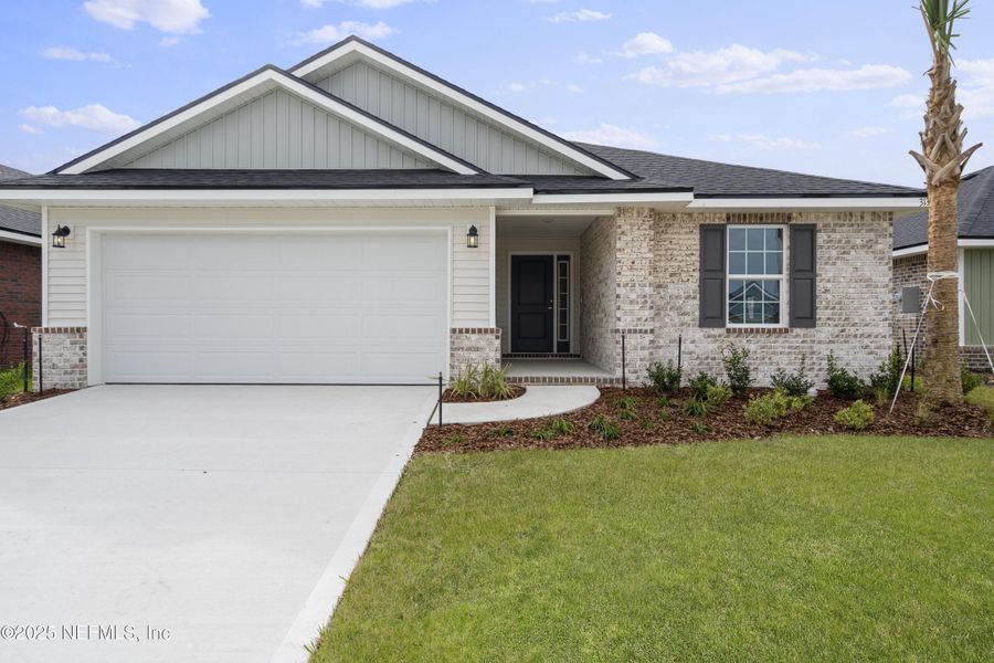 Front exterior of a new home in Shadow Crest at Rolling Hills, Green Cove Springs, FL, highlighting curb appeal (Image 2). Front exterior of a new home in Shadow Crest at Rolling Hills, Green Cove Springs, FL, highlighting curb appeal (Image 2).