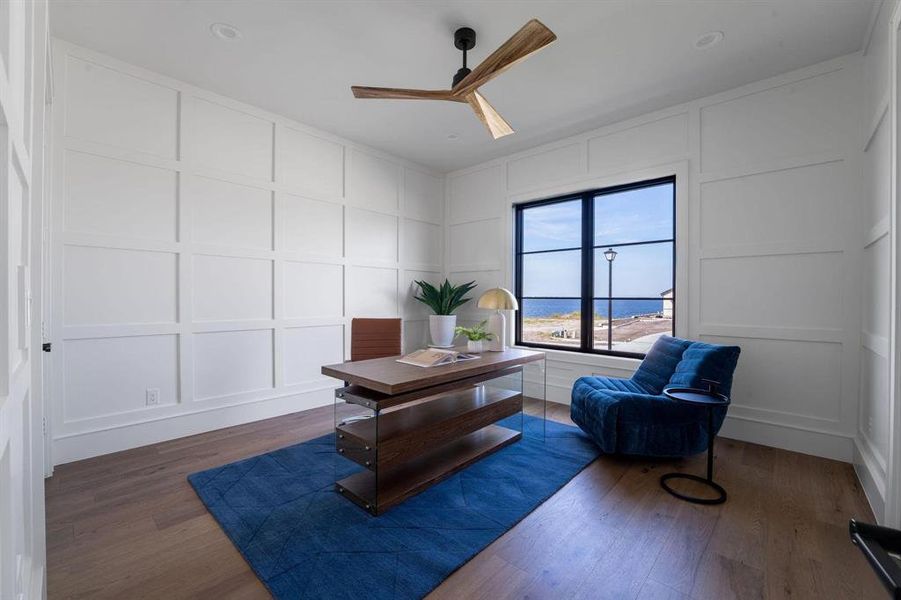 Office featuring ceiling fan and dark hardwood / wood-style floors