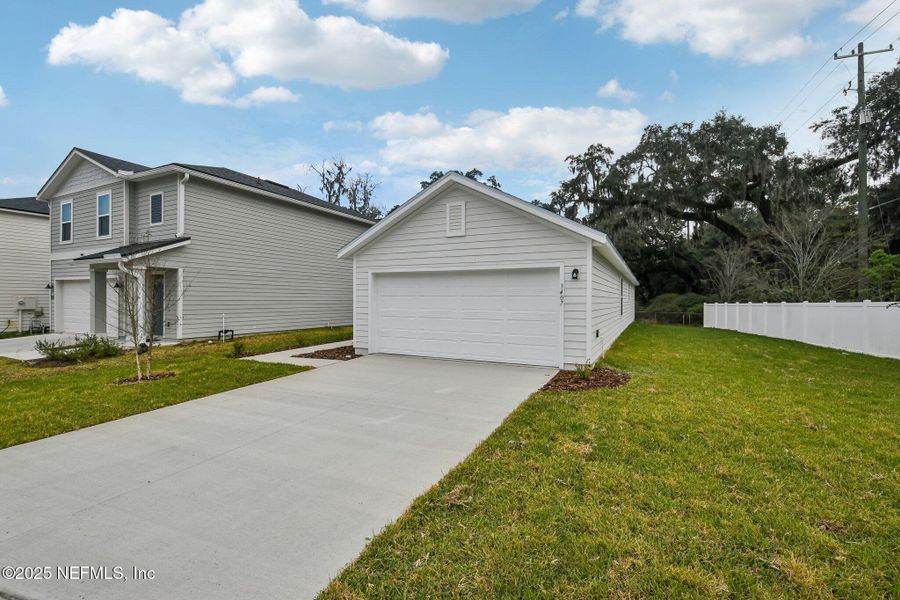 Front exterior of a new home in Kings Landing, Jacksonville, FL, highlighting curb appeal (Image 18). Front exterior of a new home in Kings Landing, Jacksonville, FL, highlighting curb appeal (Image 18).