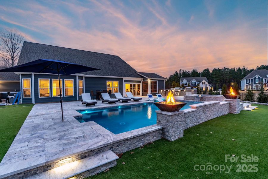 Gorgeous pool & spa surrounded by Travertine tile