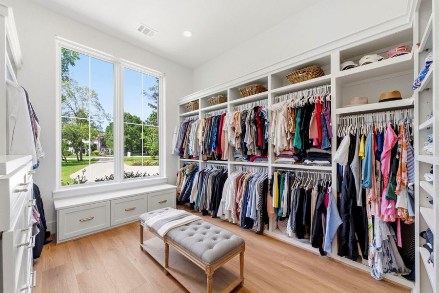 Great natural light and built-ins in the primary closet. Great natural light and built-ins in the primary closet.