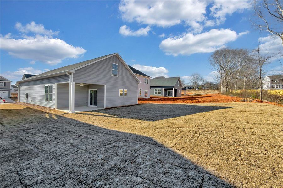 Exterior details and patio area of a home in Brownstone Park, Easley (Image 16).