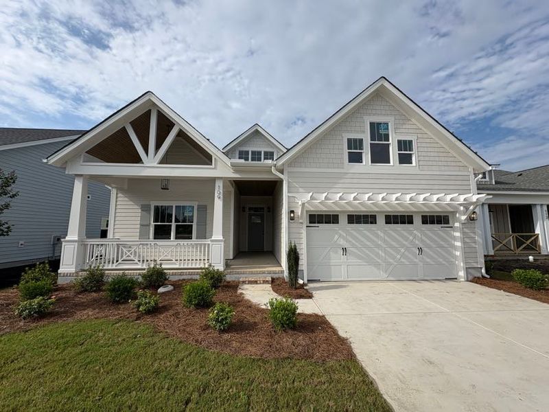Front exterior of a new home in Riverside Cove, Wilmington, NC, highlighting curb appeal (Image 2).