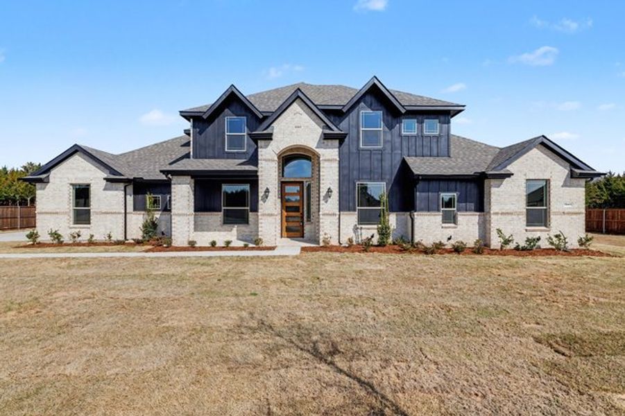 Front exterior of a new home in Sagebrush Addition, Midlothian, TX, highlighting curb appeal (Image 2). Front exterior of a new home in Sagebrush Addition, Midlothian, TX, highlighting curb appeal (Image 2).