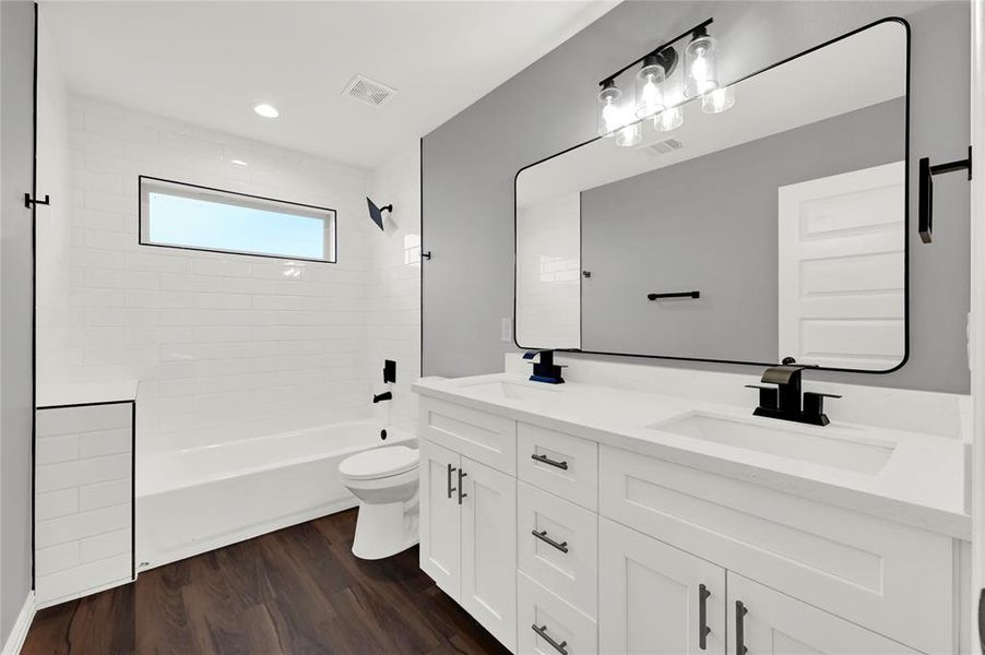 Secondary full bath with dual vanity and walk-in shower