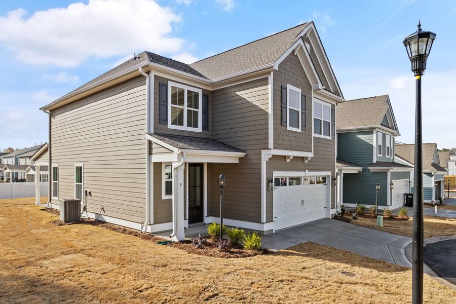 Front exterior of a new home in Phillips Crossing, Ridgeville, SC, highlighting curb appeal (Image 16).