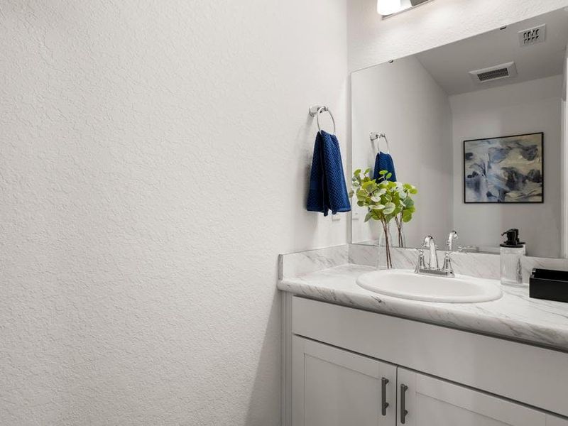 And, a downstairs powder room serves your guests - Catalina townhome by Highland Homes And, a downstairs powder room serves your guests - Catalina townhome by Highland Homes