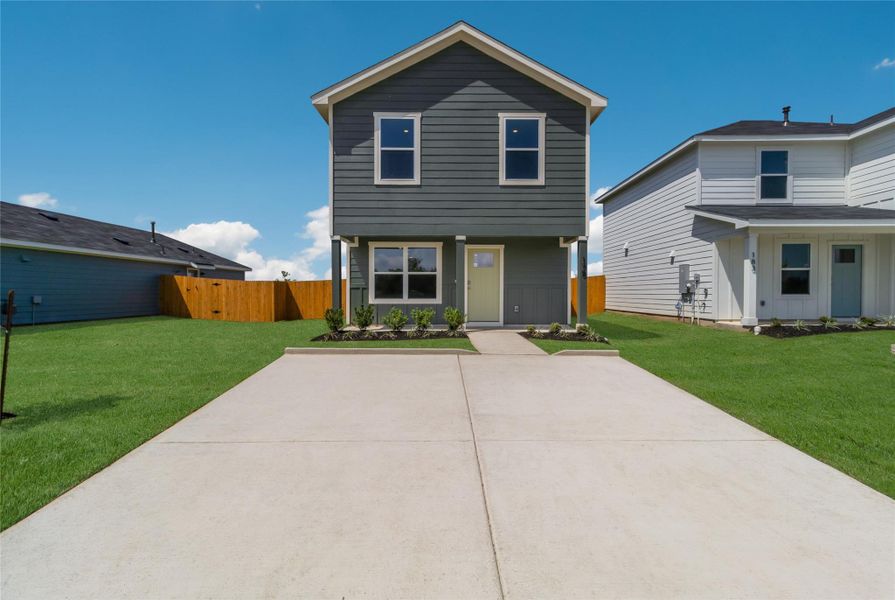 Front exterior of a new home in Marigold, Uhland, TX, highlighting curb appeal (Image 2). Front exterior of a new home in Marigold, Uhland, TX, highlighting curb appeal (Image 2).