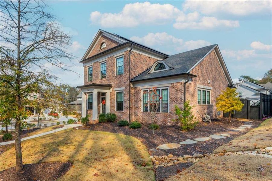 Front exterior of a new home in Barrington Place, Roswell, GA, highlighting curb appeal (Image 28). Front exterior of a new home in Barrington Place, Roswell, GA, highlighting curb appeal (Image 28).
