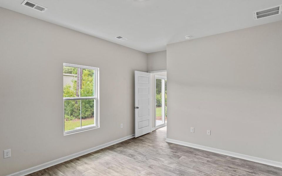 Spacious, unfurnished interior of a new home in Lindera Preserve at Cane Bay Plantation: American Dream Series - Ph 15, Summerville (Image 11). Spacious, unfurnished interior of a new home in Lindera Preserve at Cane Bay Plantation: American Dream Series - Ph 15, Summerville (Image 11).