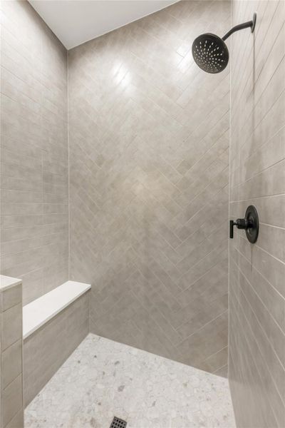 Bathroom featuring tiled shower