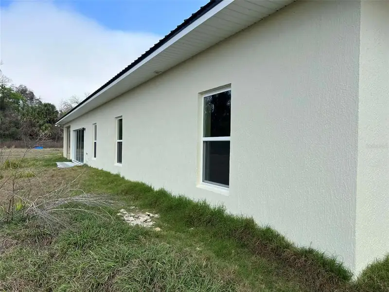 Exterior details and patio area of a home in , Ocala (Image 3).