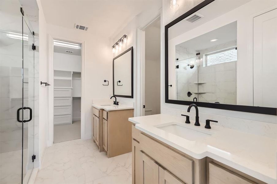 Bathroom with vanity and an enclosed shower