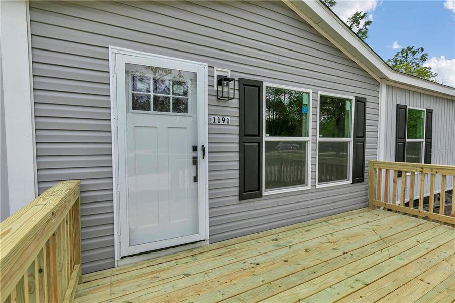 Exterior details and patio area of a home in , Williston (Image 3).
