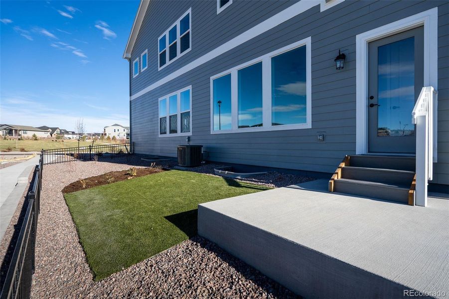 Exterior details and patio area of a home in Revel Crossing at Wolf Ranch – The Outlook Collection, Colorado Springs (Image 3).