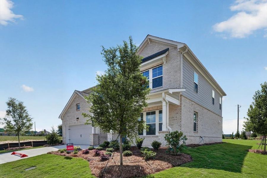 Front exterior of a new home in Nichols Farm, Dacula, GA, highlighting curb appeal (Image 24). Front exterior of a new home in Nichols Farm, Dacula, GA, highlighting curb appeal (Image 24).