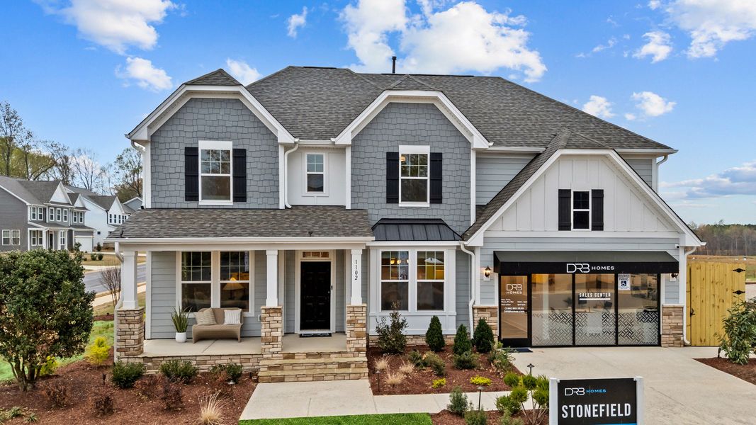 Representative exterior photo of a completed home built from the Stonefield by DRB Homes in Weavers Pointe, Zebulon, NC (Image 27).