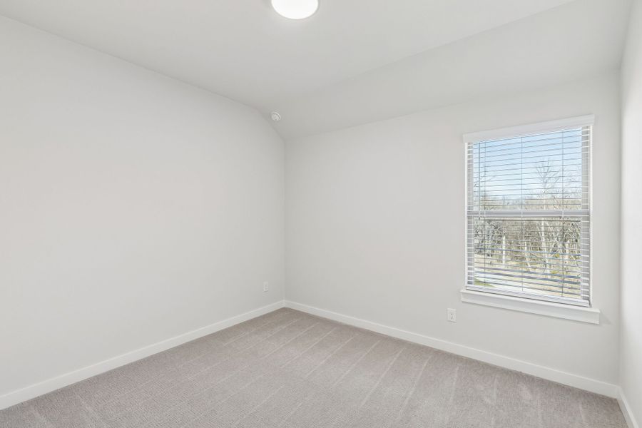 Bedroom in the Masters home plan by Trophy Signature Homes – REPRESENTATIVE PHOTO