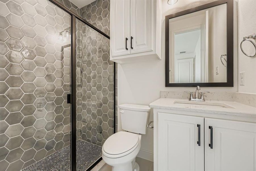 Full bathroom with a stall shower and vanity