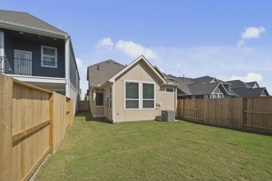 Representative exterior details of a home built from the Versailles by Chesmar Homes in Meridiana Chateau, Manvel (Image 4).
