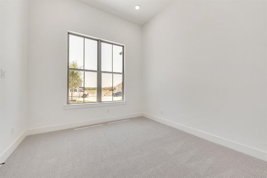 Unfurnished room with light carpet and recessed lighting Unfurnished room with light carpet and recessed lighting