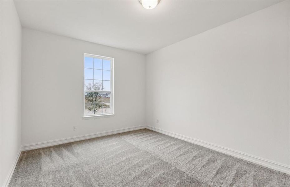 Spacious secondary bedroom with ample closeet space*real home pictured