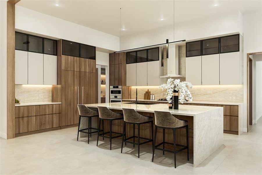 Kitchen featuring a large waterfall island with seating, integrated appliances, wood-finish cabinetry, light-toned upper cabinets with frosted glass panels, and a full-height stone backsplash