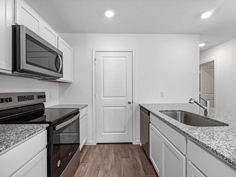 Furnished interior view inside a new home in William Trails, Willis (Image 7).