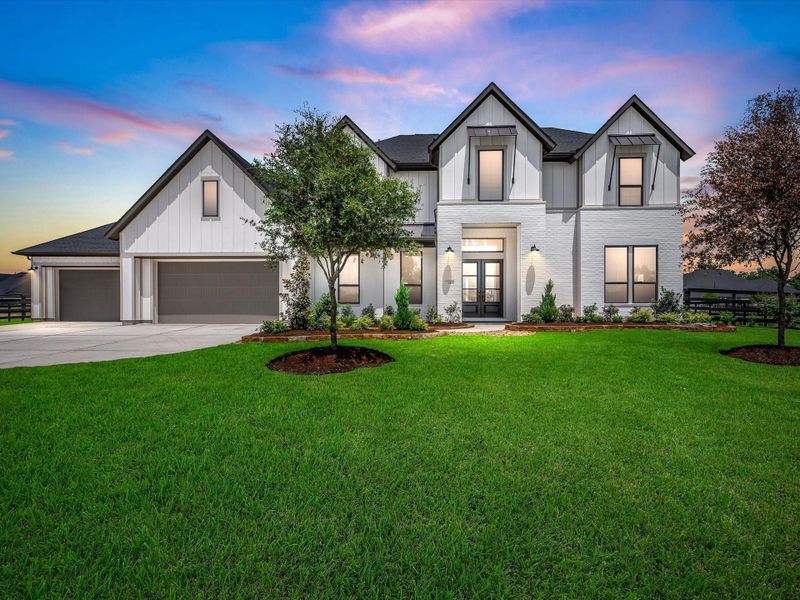 Front exterior of a new home in The Estates at James Lane, Fulshear, TX, highlighting curb appeal (Image 2). Front exterior of a new home in The Estates at James Lane, Fulshear, TX, highlighting curb appeal (Image 2).