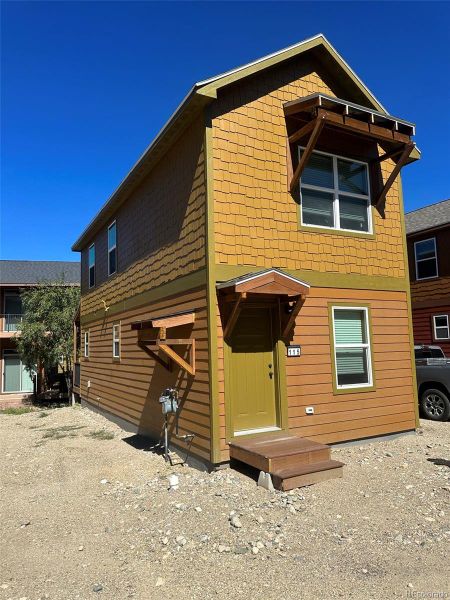 Front exterior of a new home in , Granby, CO, highlighting curb appeal (Image 1).