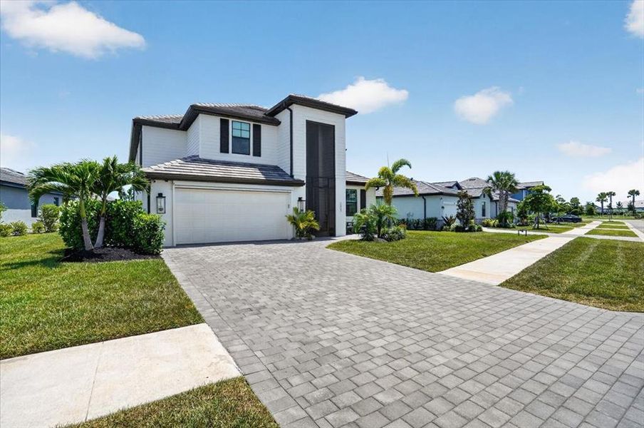 Front exterior of a new home in , Venice, FL, highlighting curb appeal (Image 26). Front exterior of a new home in , Venice, FL, highlighting curb appeal (Image 26).