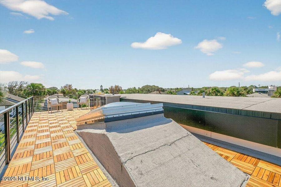 Exterior details and patio area of a home in , Neptune Beach (Image 35).