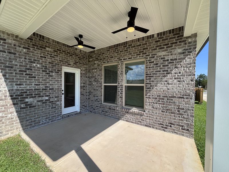 Exterior details and patio area of a home in Bird Song at Hammock Bay, Freeport (Image 4).