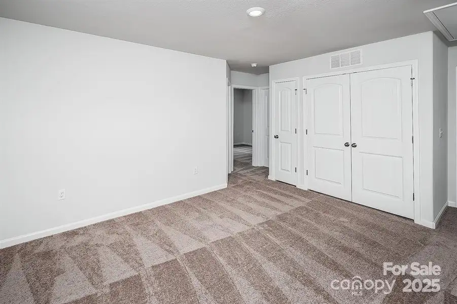 Spacious, unfurnished interior of a new home in McKee Creek Village, Charlotte (Image 15).