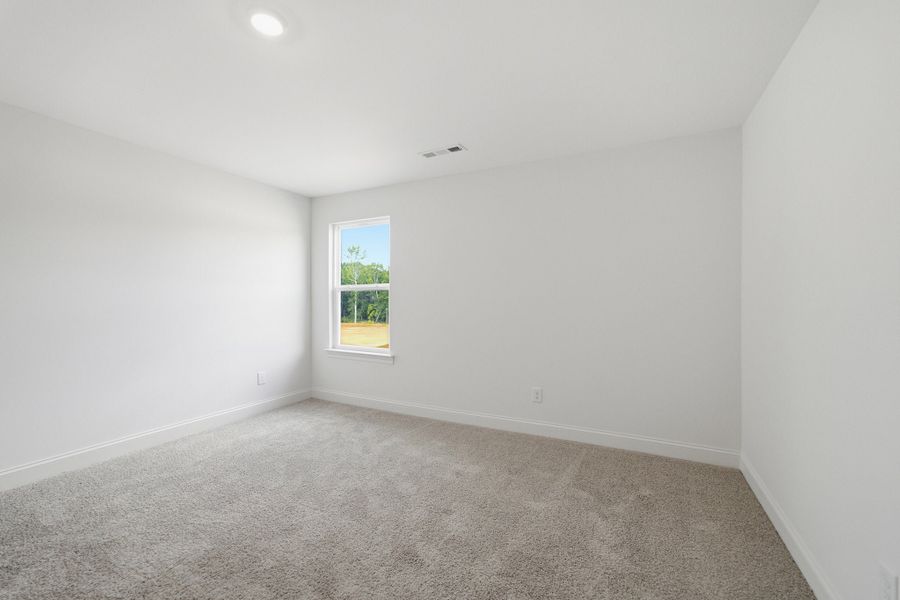 Spacious, unfurnished interior of a new home in Dorris Farm, White House (Image 40).