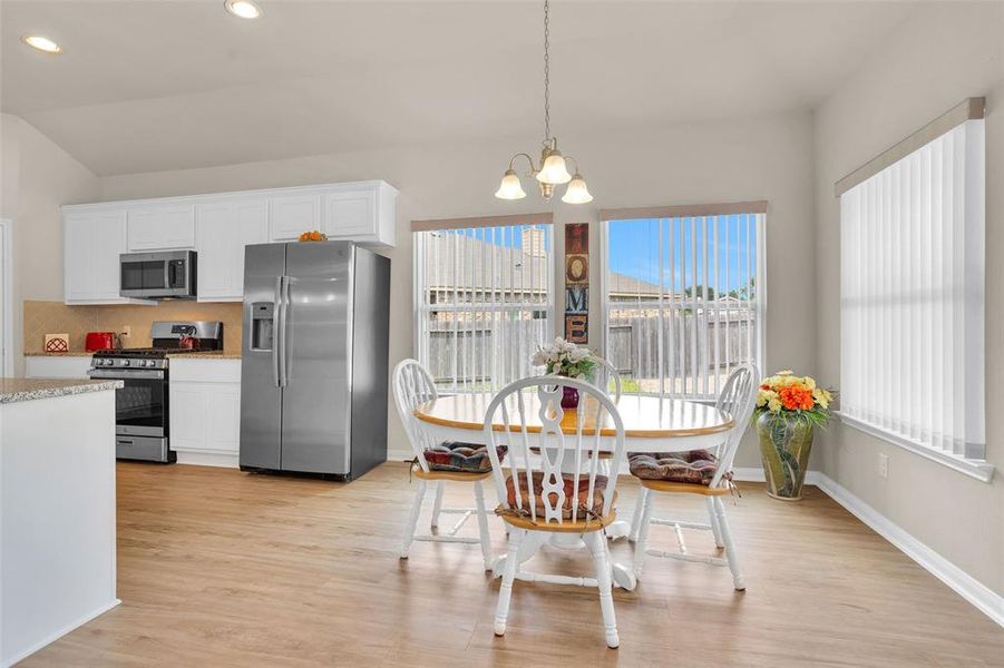 Dining area viewing the back and side yard