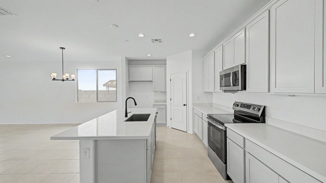Kitchen inside the move-in ready single-story Clover by DRB Homes at Sienna Park, 1315 S. 215th Drive, Buckeye, Arizona 85326 Kitchen inside the move-in ready single-story Clover by DRB Homes at Sienna Park, 1315 S. 215th Drive, Buckeye, Arizona 85326