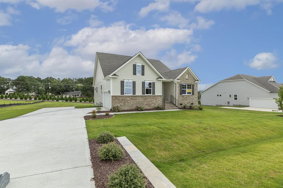 Front exterior of a new home in Berea Farms, Four Oaks, NC, highlighting curb appeal (Image 21).