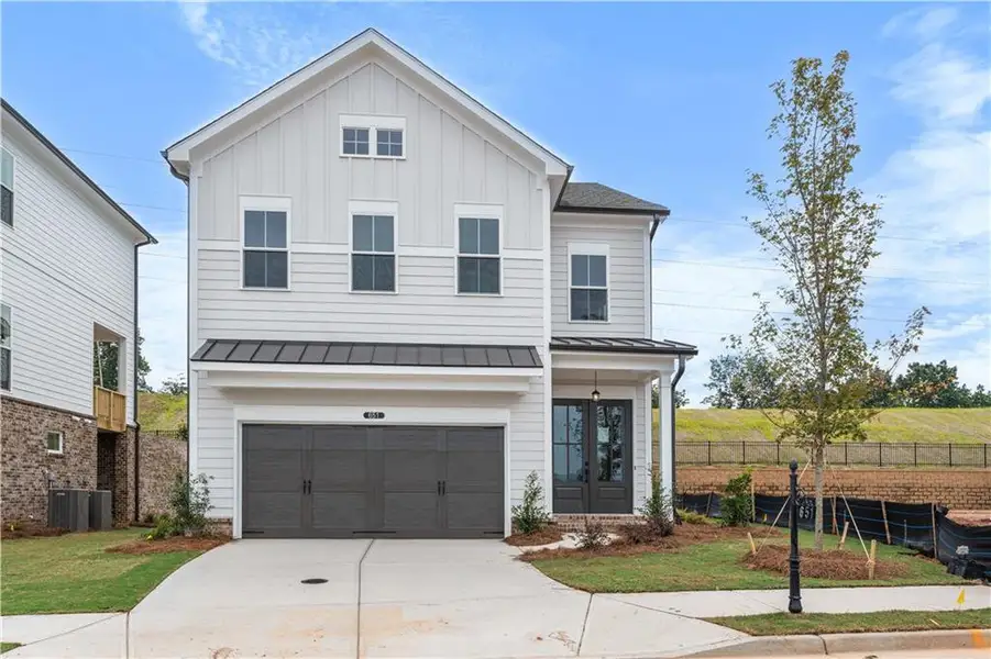 Front exterior of a new home in Palisades Single Family, Cumming, GA, highlighting curb appeal (Image 1). Front exterior of a new home in Palisades Single Family, Cumming, GA, highlighting curb appeal (Image 1).